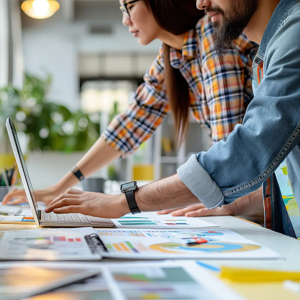 Designer creating marketing graphics, brand assets, templates, and campaign visuals in a structured creative production workflow.