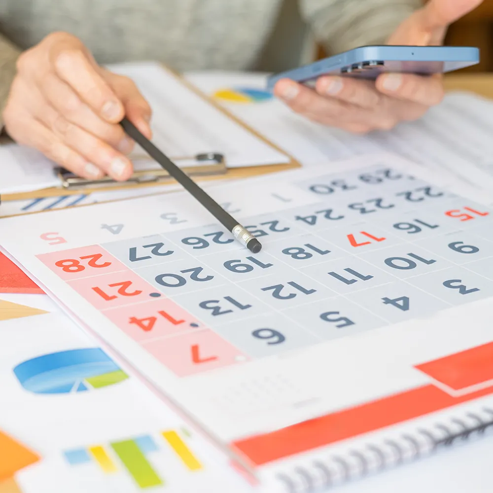 Marketing strategist planning multi-channel social media campaigns with audience targeting, branded visuals, and performance analytics.